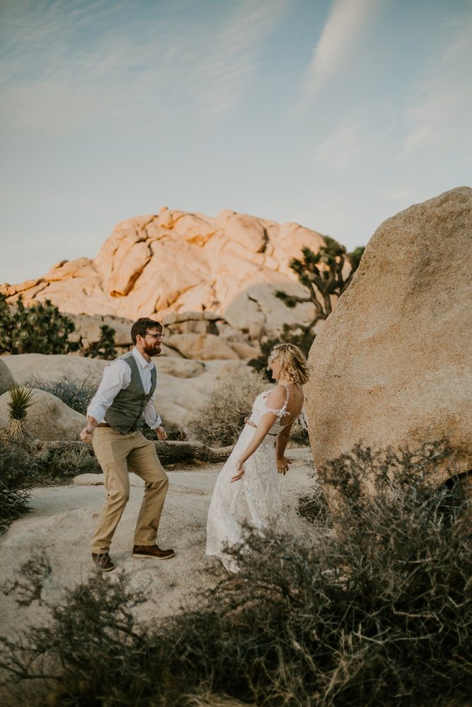 Couple playing among the Joshua Tree boulders