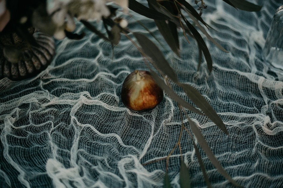 A fig on gauze linen with eucalyptus
