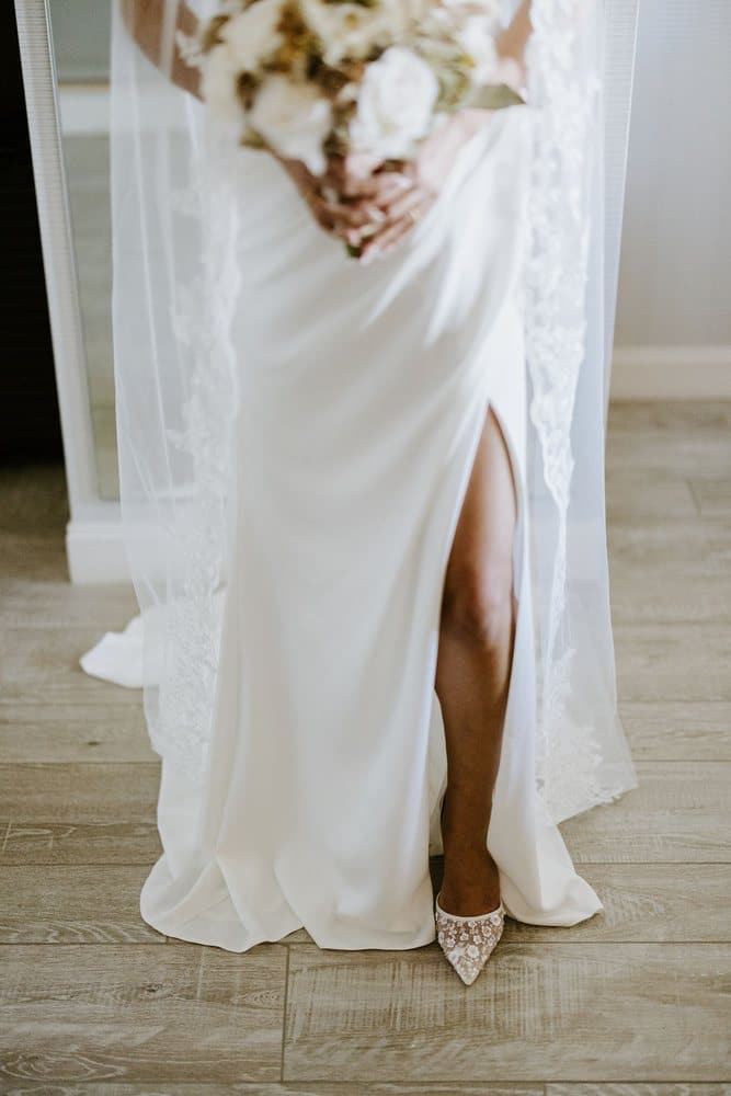 Beaded heels and a high slit under the veil