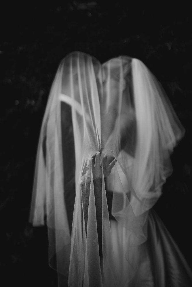 Couple wrapped in a veil, black and white