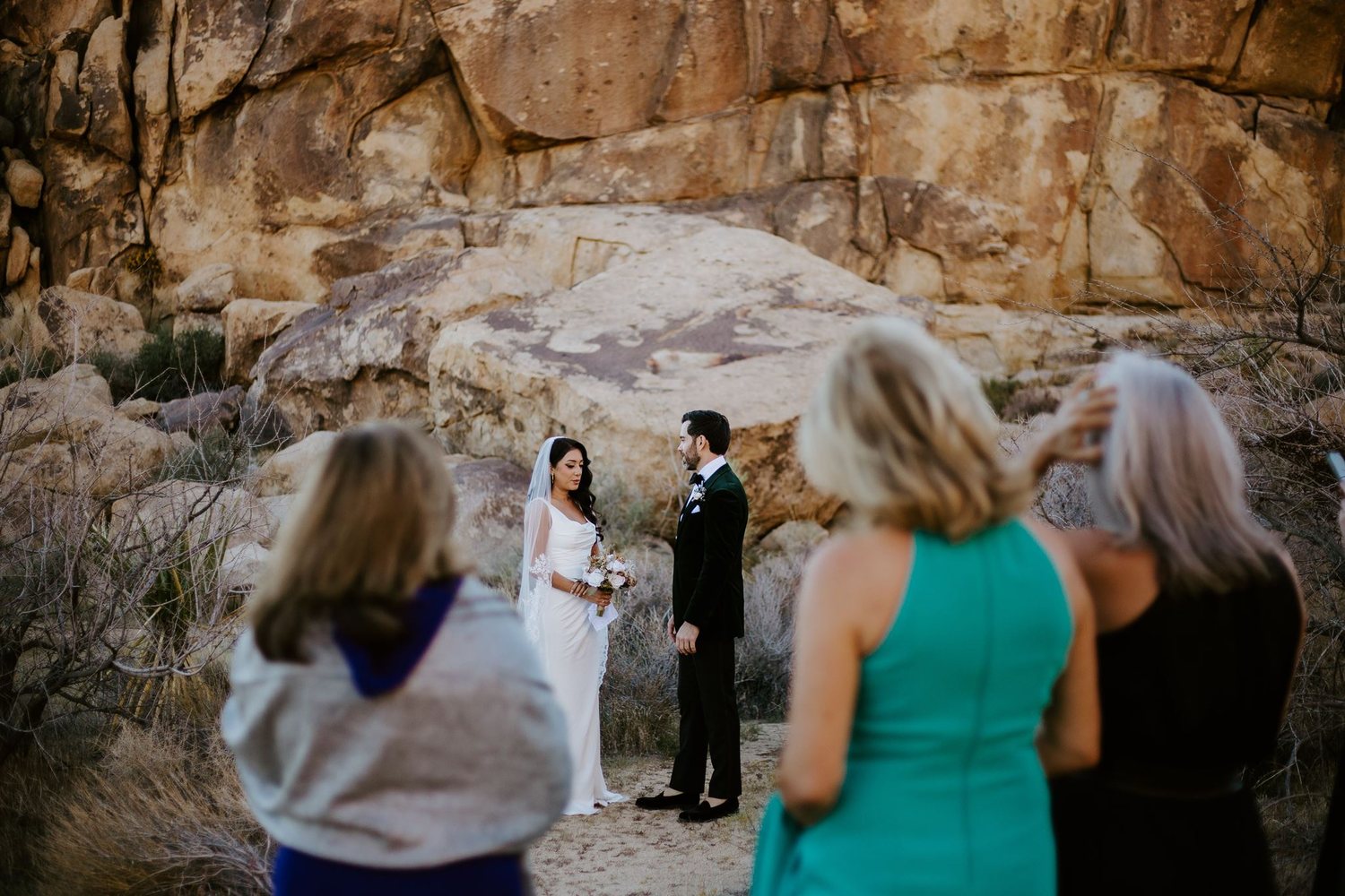 Family watching the ceremony among the rocks