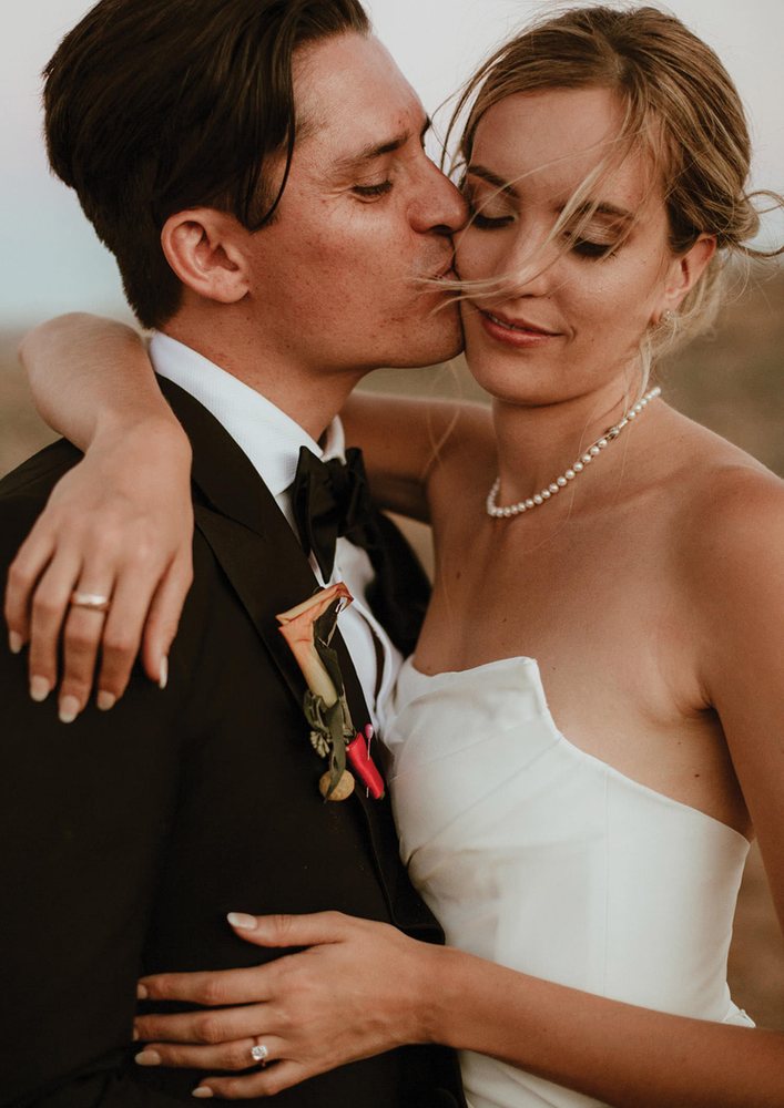 Kiss on the cheek at sunset