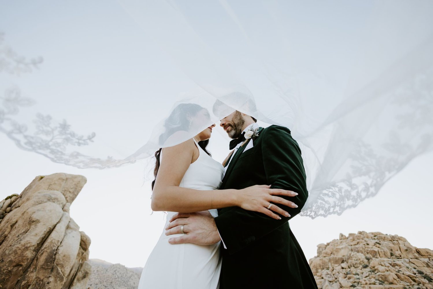 Under a flying lace veil among the rocks