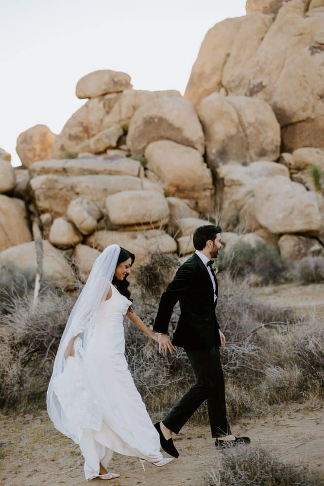 Walking hand in hand past the boulders