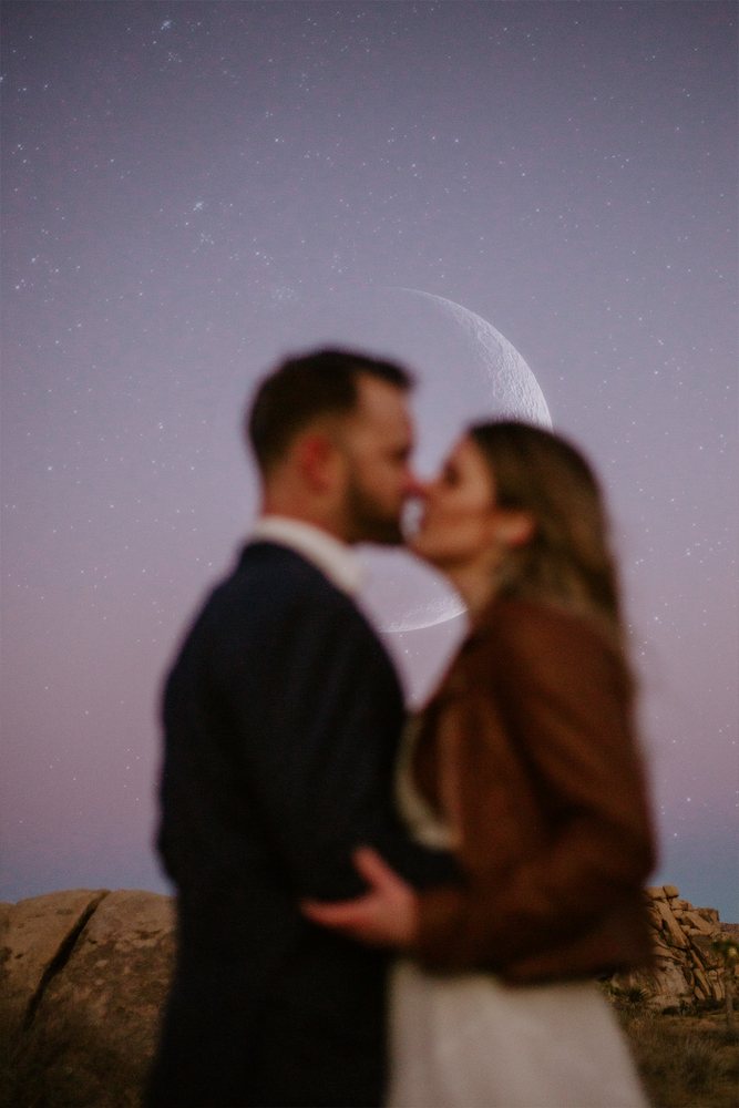 Kiss under the moon after sunset in Joshua Tree