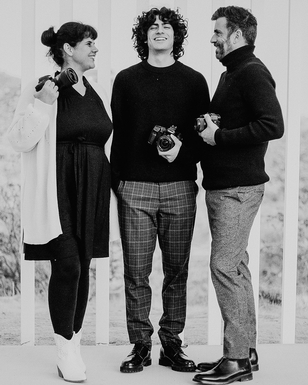 Rocker in Love, Joshua Tree elopement photographers, laughing together with their cameras